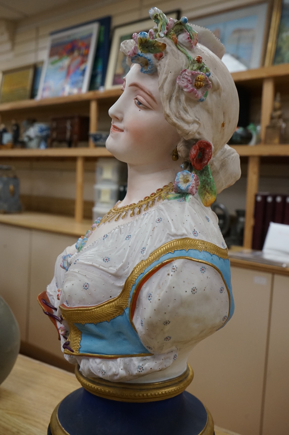A Paris painted biscuit porcelain bust of a woman, stamped L&M, 50cm